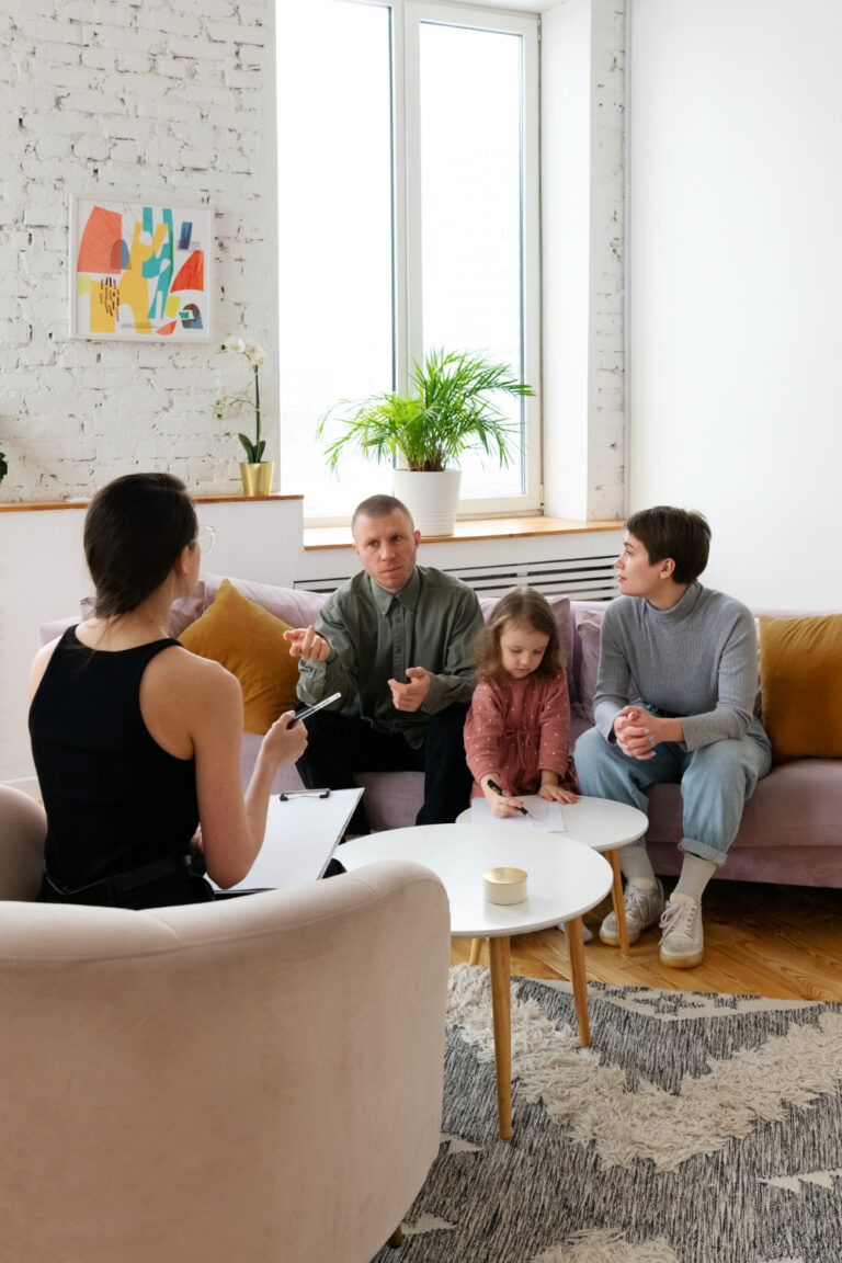 Parents and their child seated together during a family counseling conversation