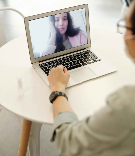 Person in video session with online substance abuse counselor in California