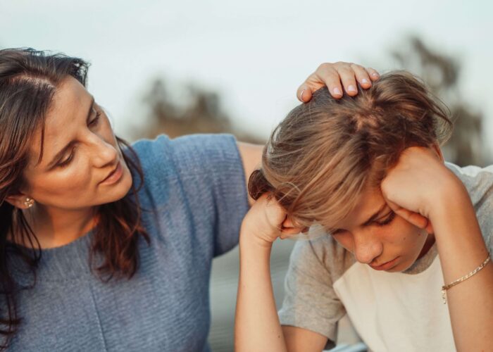 How to Talk to Children About a Parent’s Addiction Caregiver talking to a child about a parent's addiction and substance abuse