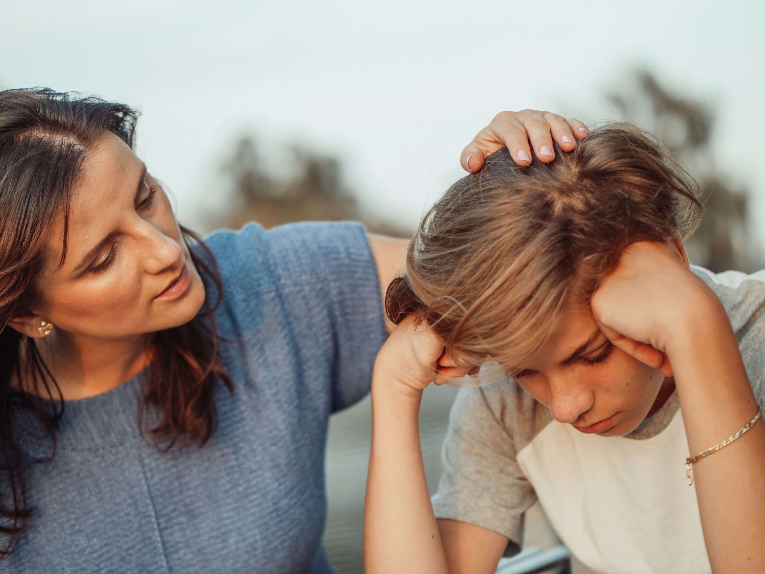 Caregiver talking to a child about a parent's addiction and substance abuse